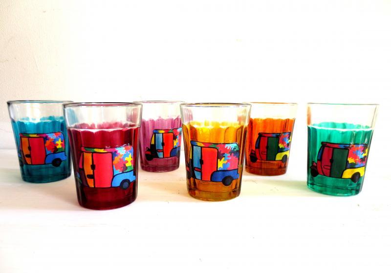 Lifestyle craft titled 'Rickshaw Cutting Chai Glasses', 3x2x2 inches, by artist Rithika Kumar on Glass