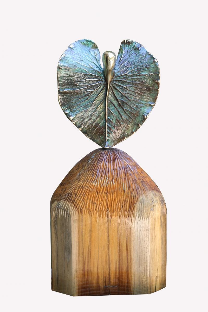 Figurative sculpture titled 'Unique Form', 20x9x5 inches, by artist Shivarama Chary Y on Oxidized Bronze, Wood