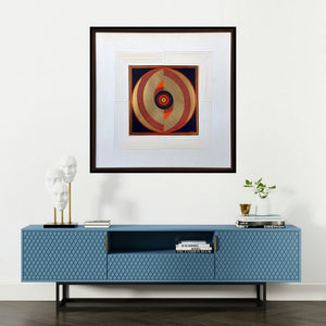 'Asymmetry (Circular Abstraction in Gold and Red)' painting by Bhiva Punekar shown on a wall in a furnished room.