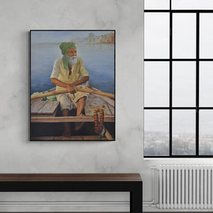 Preview of 'Banaras (Monk at Buddha Statue)' Painting by Kamal Rao shown on a wall in a furnished room.