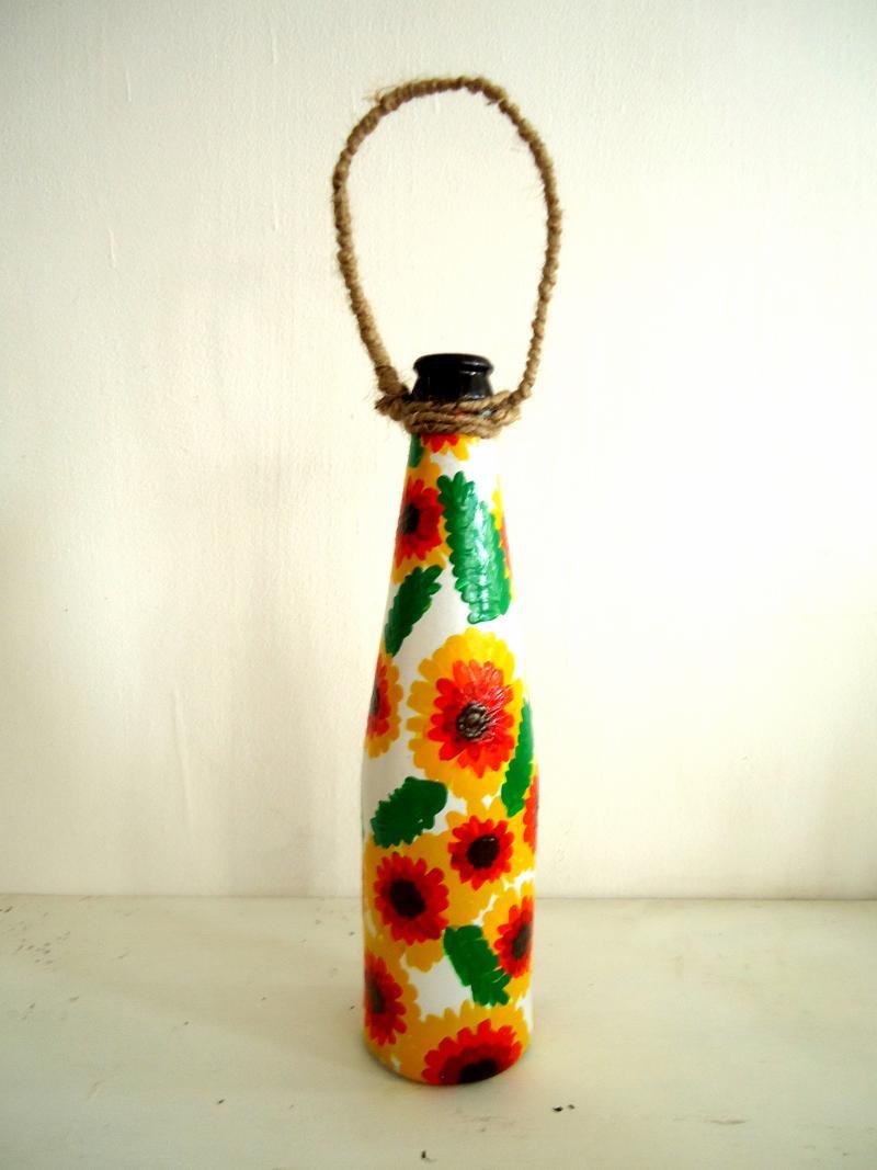 Lifestyle craft titled 'Bottle Planter Yellow And Orange', 9x3x9 inches, by artist Rithika Kumar on Recycled Glass