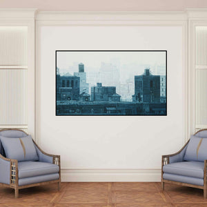 'Cityscape 4 (Foggy Cityscape II)' painting by Ganesh Pokharkar shown on a wall in a furnished room.