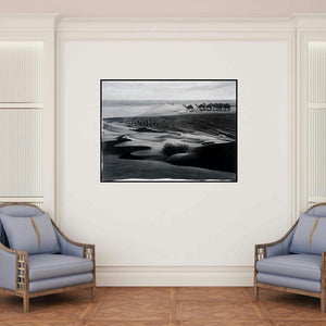 'Desert (Desert Crossing)' painting by Manish Sharma shown on a wall in a furnished room.