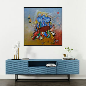 'Ganesha Playing Dholak (Divine Rhythm)' painting by M Singh shown on a wall in a furnished room.