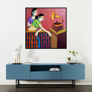 'Girls Playing Gramophone (A Melody of the Past)' painting by Pravin Utge shown on a wall in a furnished room.