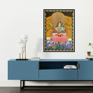 'Golden Womb Series Laxmi (Golden Lotus Goddess)' painting by Seema Kohli shown on a wall in a furnished room.