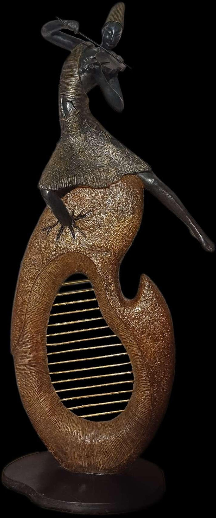 Immersed In The Tune' figurative Bronze sculpture by artist Subrata Paul, 55x25 inch, on bronze