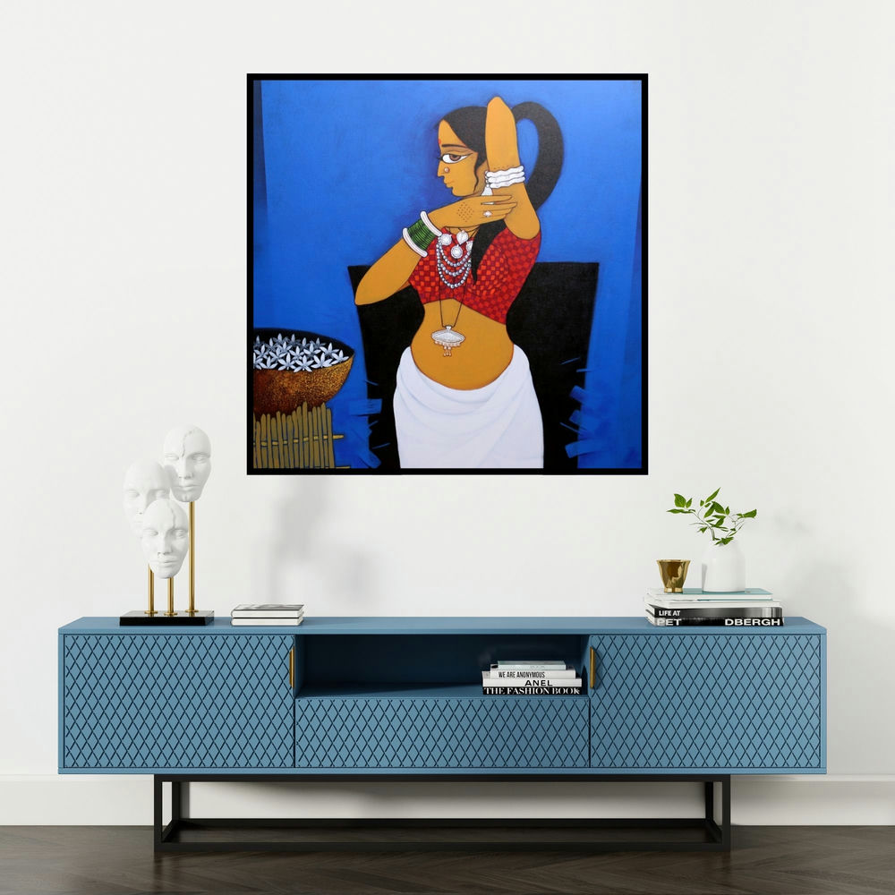 'Lady With Flower 2 (Adorning Herself)' painting by Gajraj Chavan shown on a wall in a furnished room.