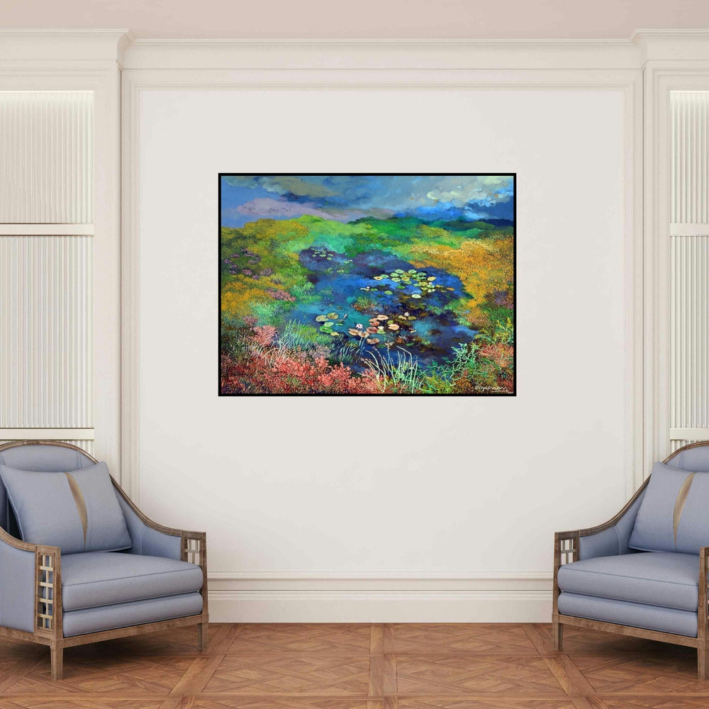 'Landscape (Serene Pond)' painting by Surya Prakash shown on a wall in a furnished room.