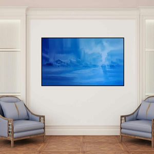 'Landscape Vi (Azure Haze: A City in Dreams)' painting by Narayan Shelke shown on a wall in a furnished room.