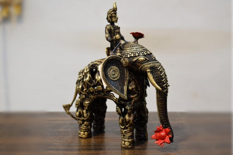 Figurative sculpture titled 'Men Figure Elephant With Sitting Men', 13x13x4 inches, by artist Kushal Bhansali on Brass