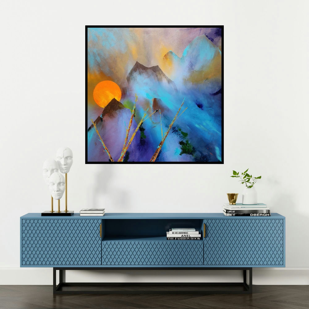 'Mountains (Sunlit Peaks)' painting by Sanjay Dhawale shown on a wall in a furnished room.