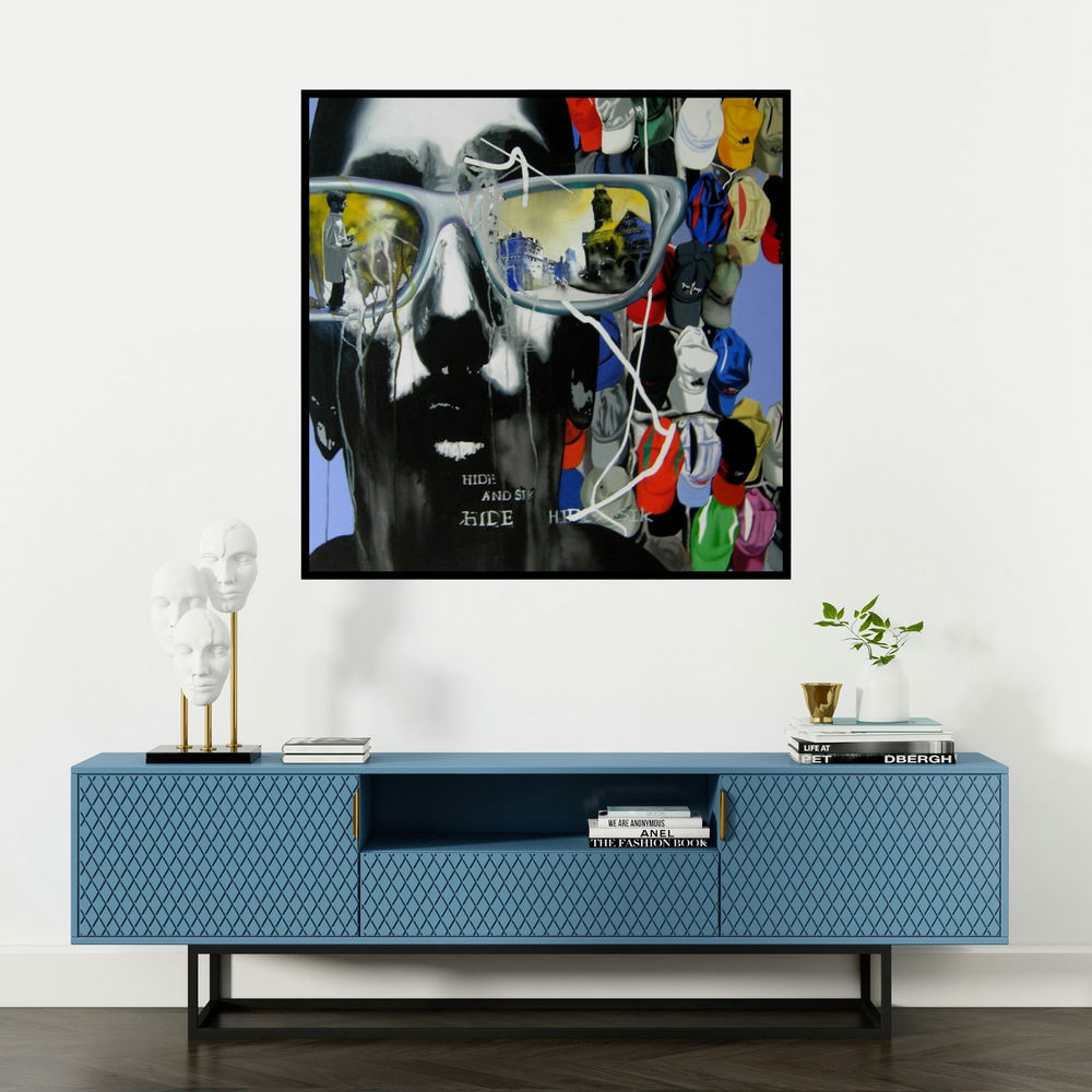 'Mumbai (Hide and Seek)' painting by Manohar Rathod shown on a wall in a furnished room.