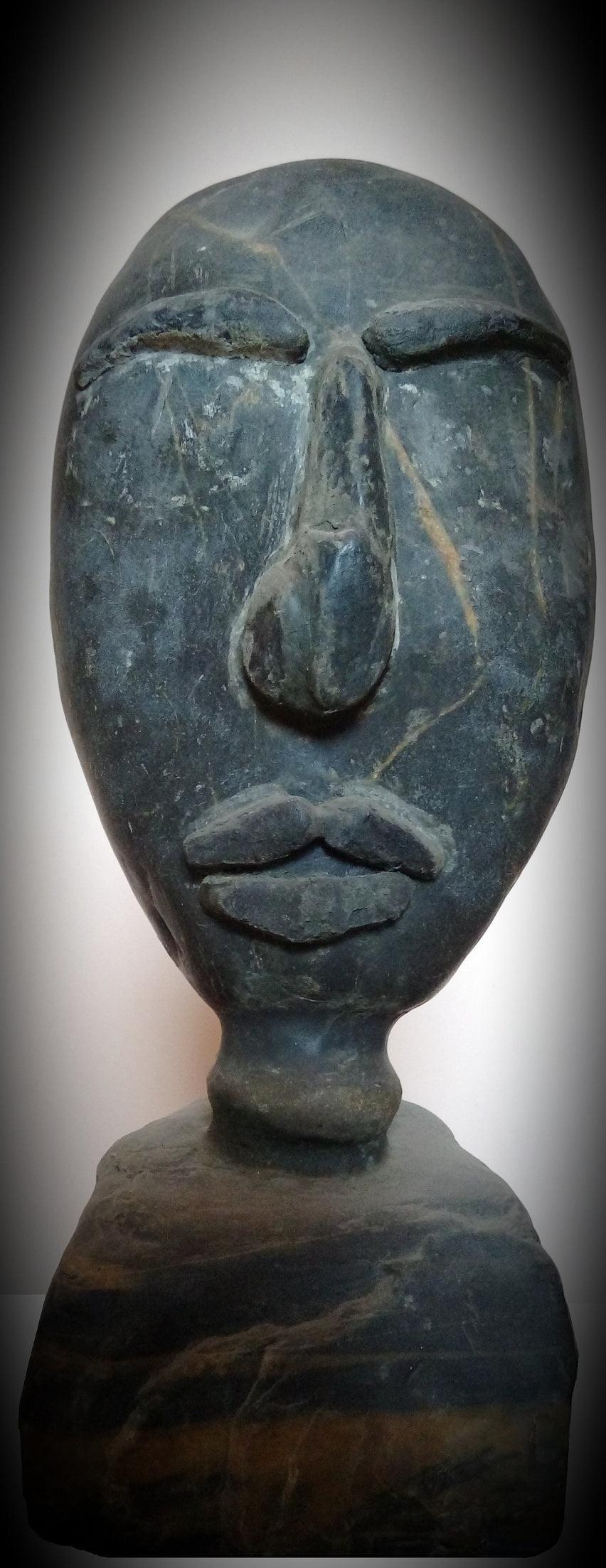 Figurative sculpture titled 'Noddle', 16x7x5 inches, by artist Shibu Sengupta on Stone