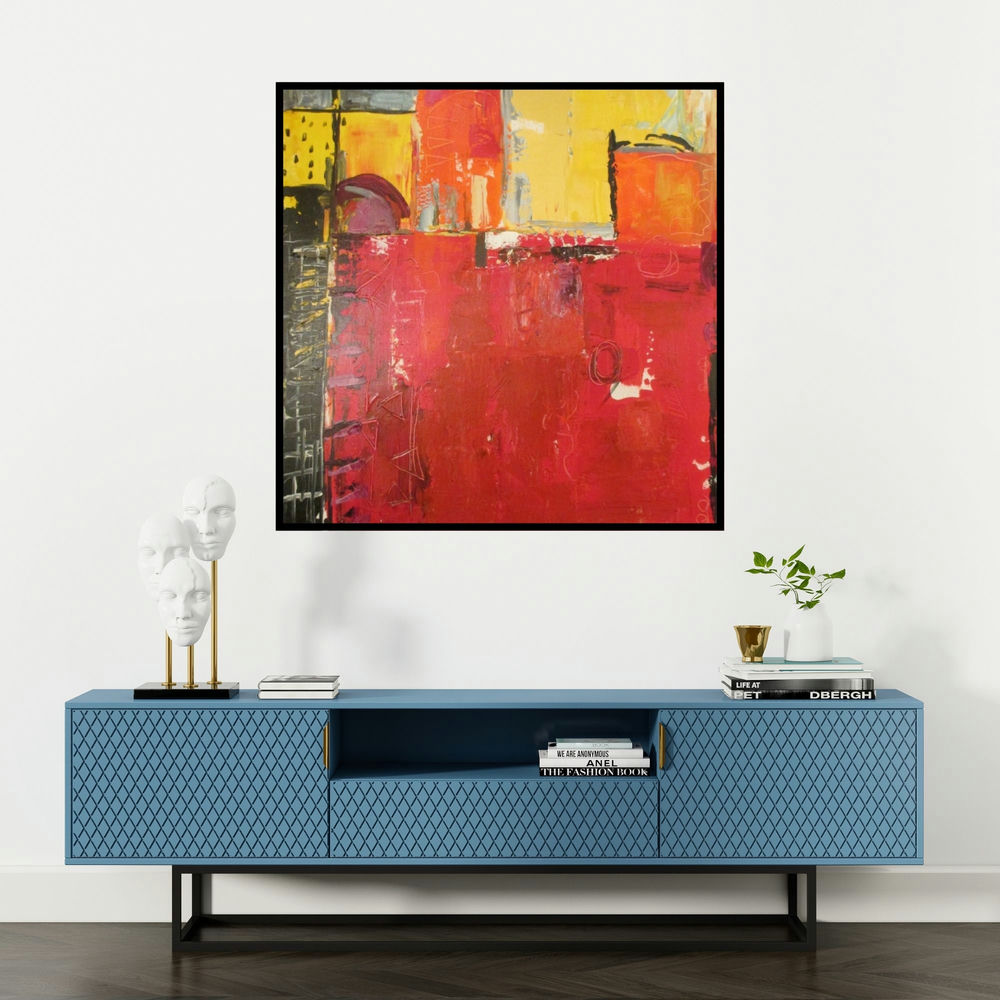 'painted puzzle (Interlocking Hues)' painting by Romaine Kaufman shown on a wall in a furnished room.