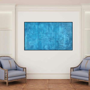 'Solid Blue Abstarct I' painting by Mohit Bhatia shown on a wall in a furnished room.