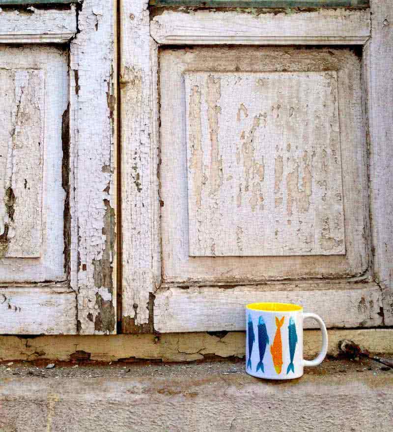 Lifestyle craft titled 'Something Fishy Mug', 4x3 inches, by artist Rithika Kumar on Ceramic