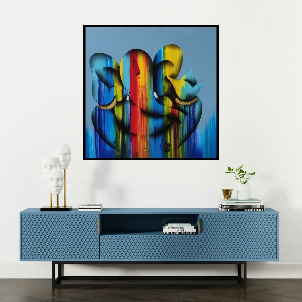 'Sukhkarta (Ganesha in Rainbow Hues)' painting by Paras Parmar shown on a wall in a furnished room.