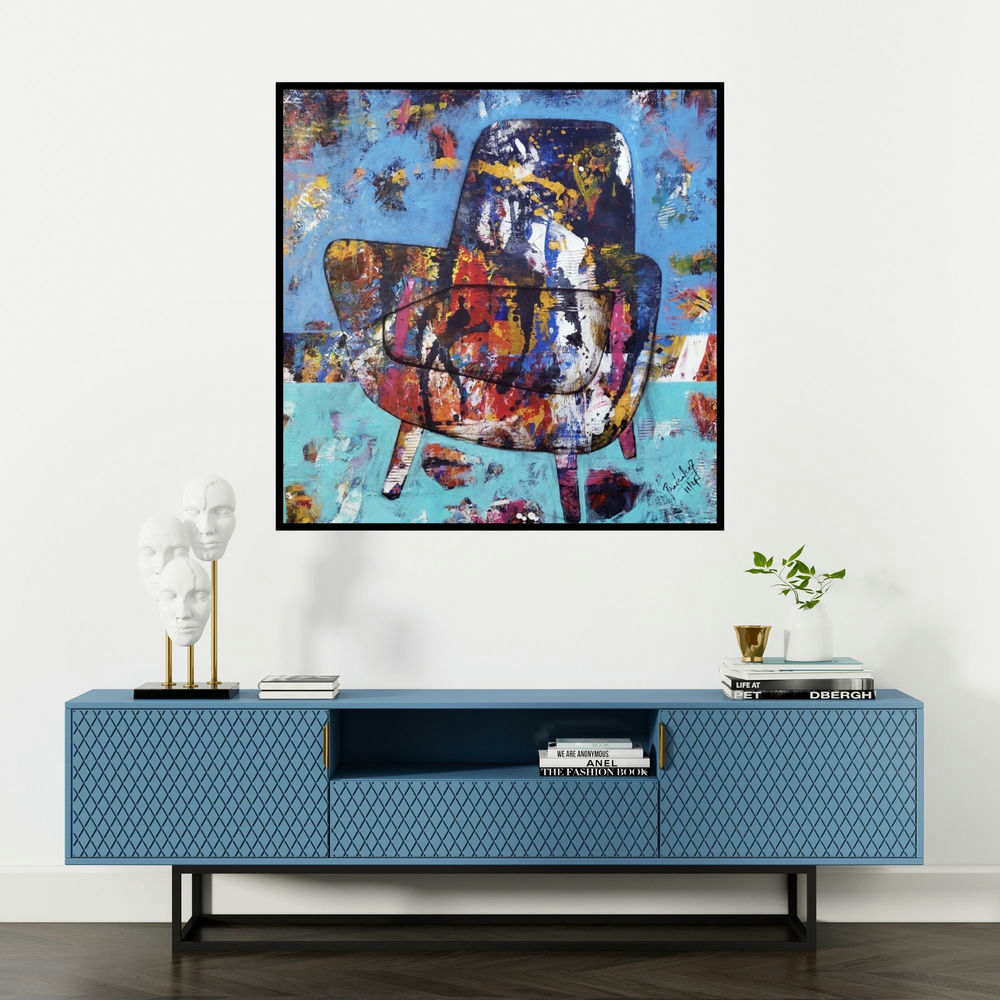 'The Mighty Chair 2 (The Daydream Chair)' painting by Prashalee Gaikwad shown on a wall in a furnished room.