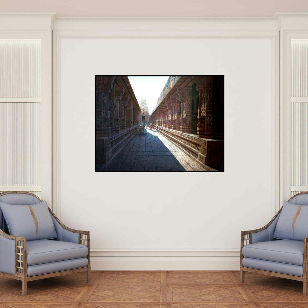'Vitthala Temple Hampi 39 (Ancient Temple Passage)' painting by Pravin Pasare shown on a wall in a furnished room.