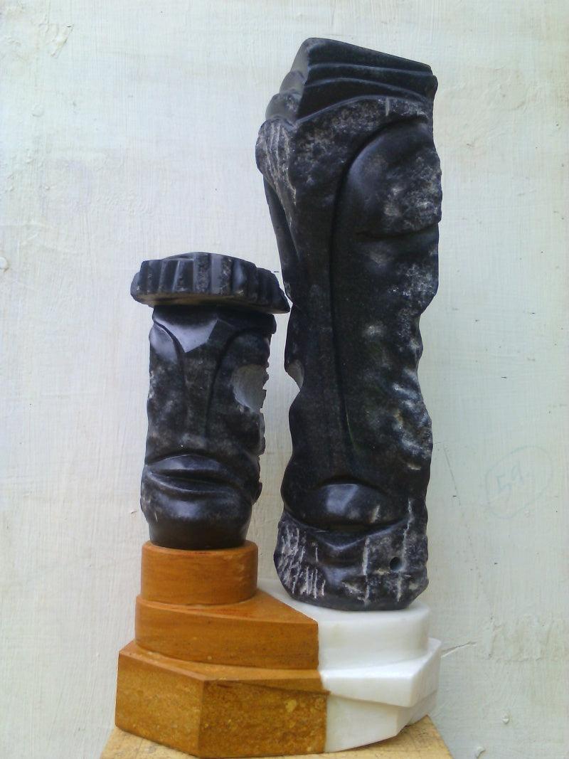 Figurative sculpture titled 'Couple 2', 12x9x6 inches, by artist Nema Ram on black marble