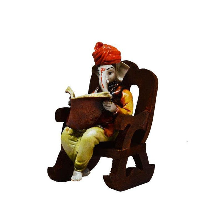 Ganesha Reading Book On Wooden Chair Handicraft by E Craft | ArtZolo.com