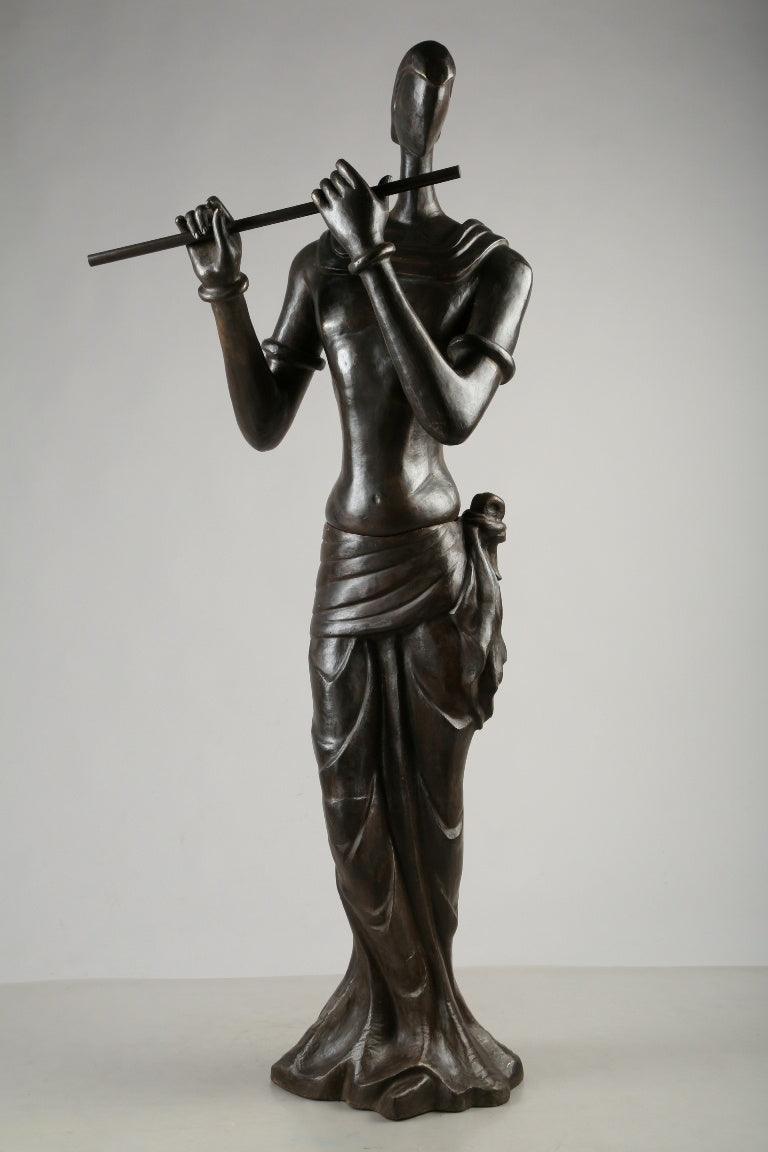 Figurative sculpture titled 'Krishna', 65x19x17 inches, by artist Tapas Sarkar on Bronze