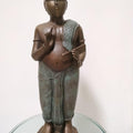Figurative sculpture titled 'Pandit', 25x8x7 inches, by artist Thota Vaikuntam on Bronze