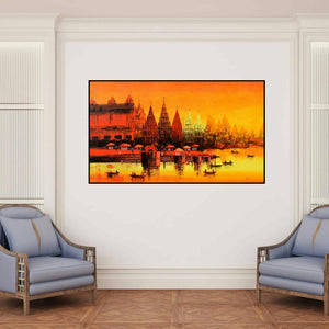 'Banaras Ghat 58 (Golden Dawn on the Ganges)' painting by Reba Mandal shown on a wall in a furnished room.