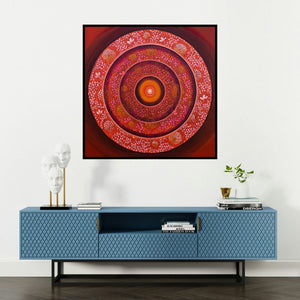 'Bindu The Consciusness Series 3 (The Cosmic Bloom)' painting by Nitu Chhajer shown on a wall in a furnished room.