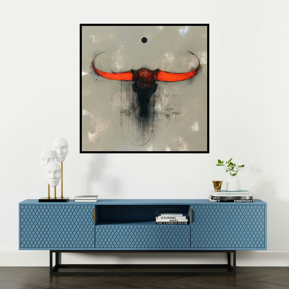'Bull Face' painting by Amol Pawar shown on a wall in a furnished room.