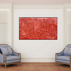 'Cityscape 12 (Red Abstract)' painting by Rama Krishna V shown on a wall in a furnished room.
