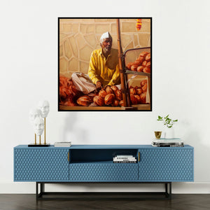 'Coconut Seller' painting by Vinayak Takalkar shown on a wall in a furnished room.