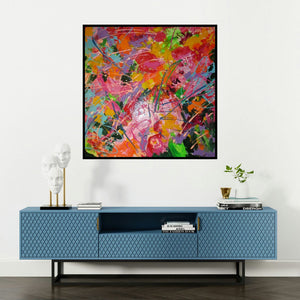 'constant search for balance (Vibrant Chaos)' painting by Romaine Kaufman shown on a wall in a furnished room.