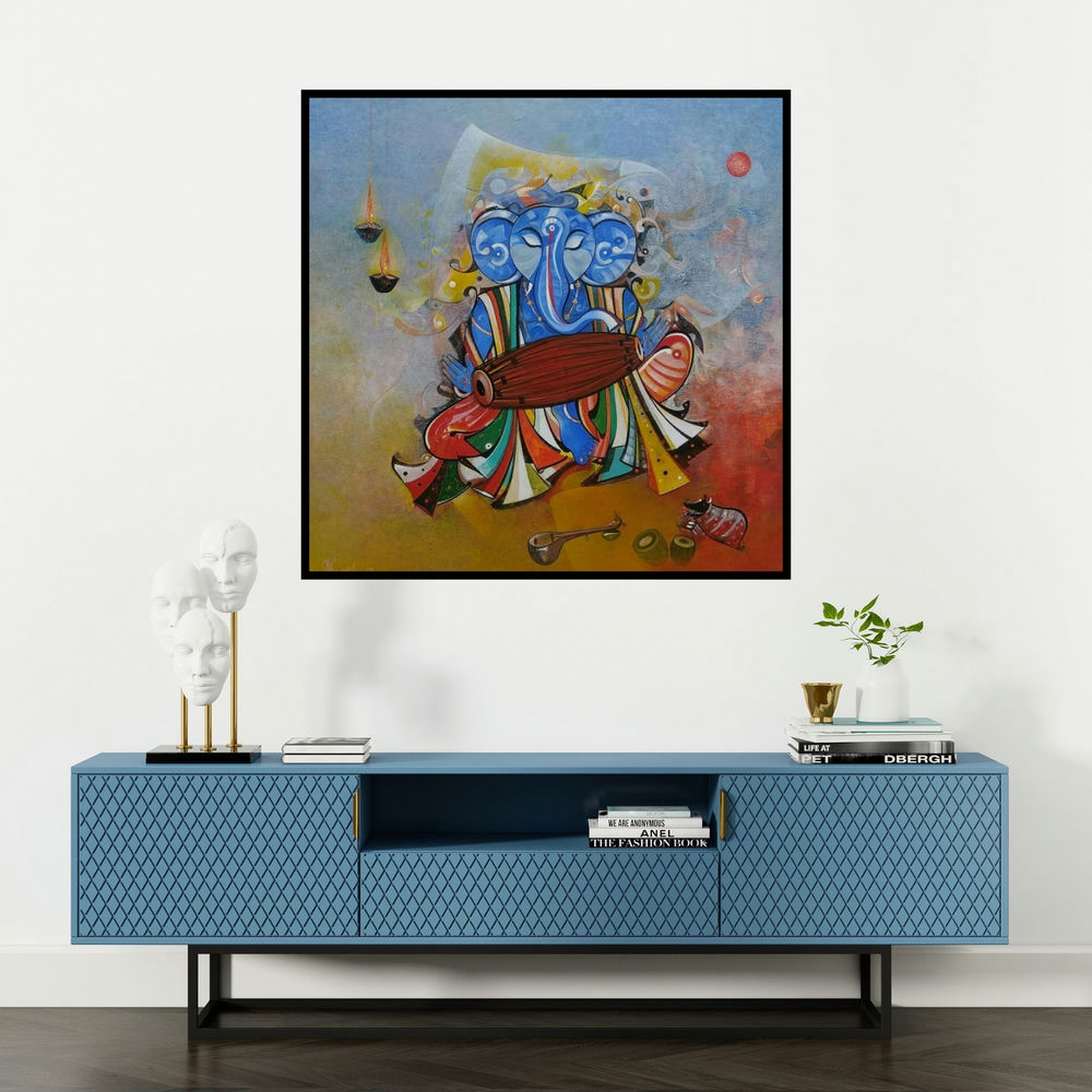 'Ganesha Playing Dholak (Divine Rhythm)' painting by M Singh shown on a wall in a furnished room.