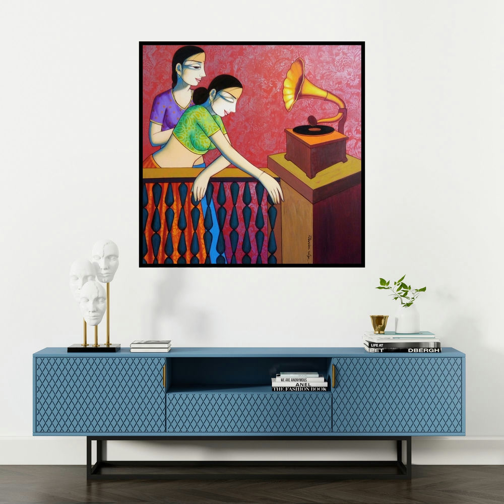 'Girls Playing Gramophone (A Melody of the Past)' painting by Pravin Utge shown on a wall in a furnished room.
