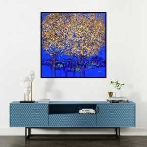 'Golden Tree Of Life' painting by Bhaskar Rao shown on a wall in a furnished room.