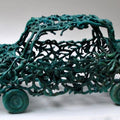 Transportation sculpture titled 'Green Car', 11x19x10 inches, by artist Tarun Maity on Bronze