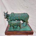 Kamdhenu Cow' religious Brass, Metal sculpture by artist Rohan Sonavane, 13x10 inch, on brass, metal
