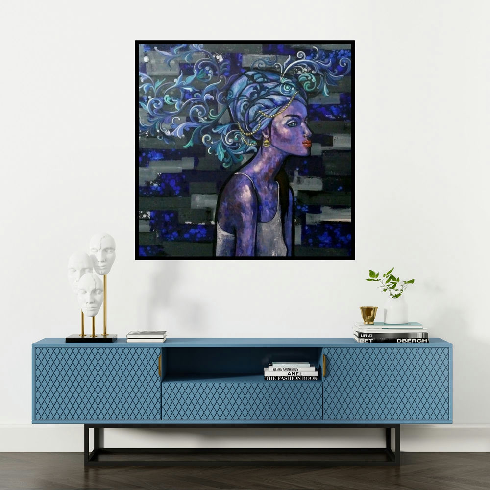 'At Leisure (Indigo Dreams)' painting by Suruchi Jamkar shown on a wall in a furnished room.