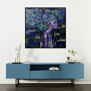 'At Leisure (Indigo Dreams)' painting by Suruchi Jamkar shown on a wall in a furnished room.