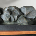Figurative sculpture titled 'Liying Lady', 5x13x4 inches, by artist Shankar Ghosh on Bronze