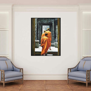 'Monks' painting by Kamal Rao shown on a wall in a furnished room.