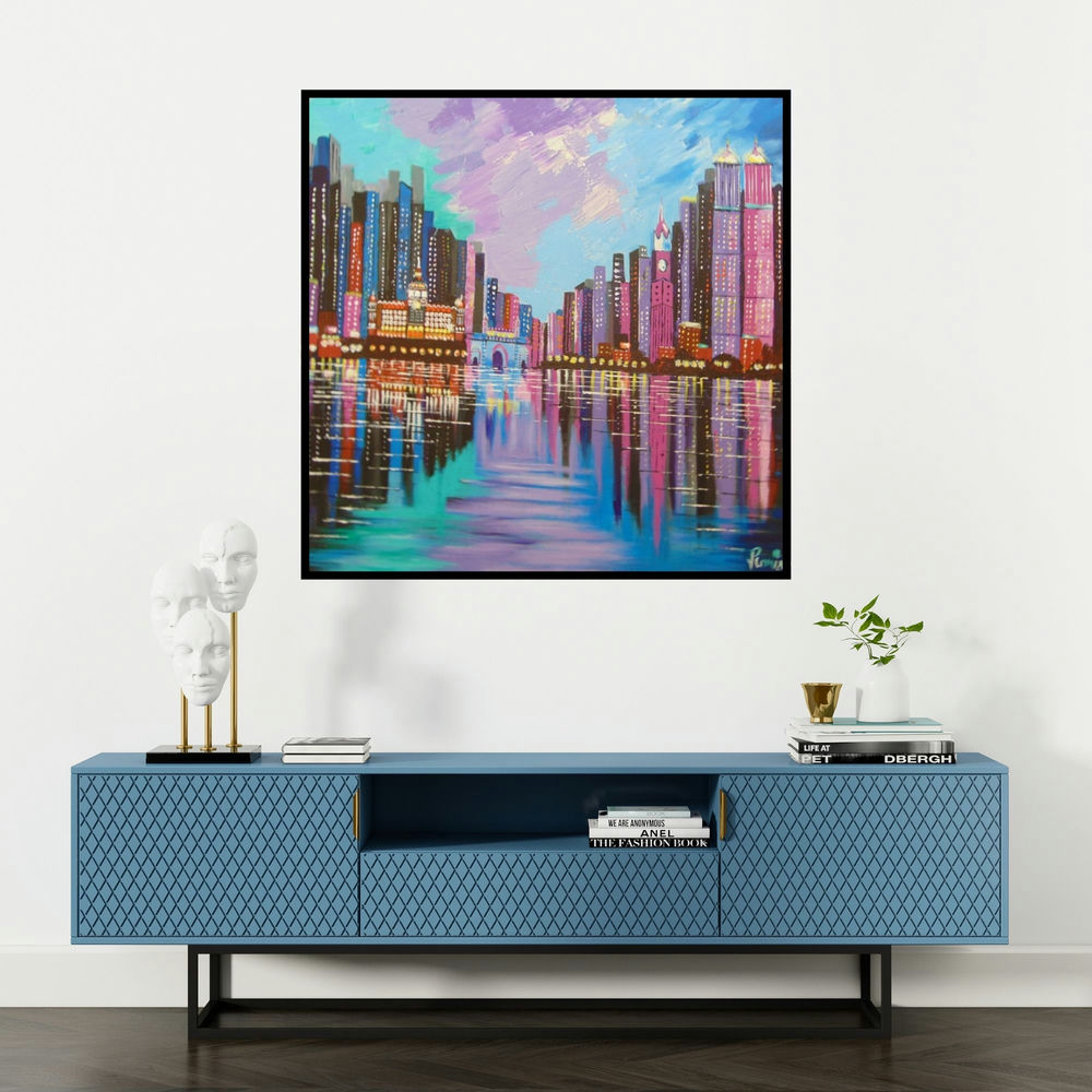 'Mumbai Skyline (City Lights)' painting by Purnima Gupta shown on a wall in a furnished room.