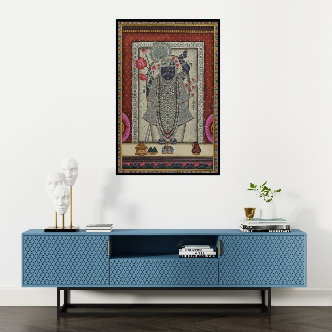 Preview of 'Pichwai (Shrinathji's Jeweled Majesty)' Painting by Unknown shown on a wall in a furnished room.