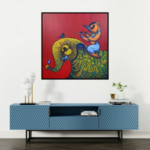 'Playing Flute On Elephant 1 (Elephant Serenade)' painting by Ramesh Gujar shown on a wall in a furnished room.