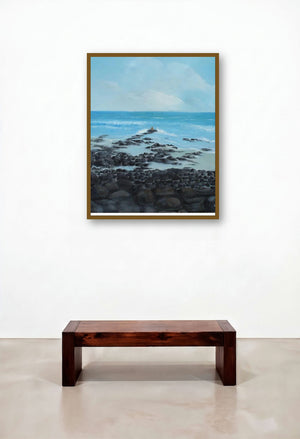 Rocky Beach (Shoreline Serenity: A Coastal Landscape) by artist Persis Chhapkhanawalla displayed in a Industrial Library