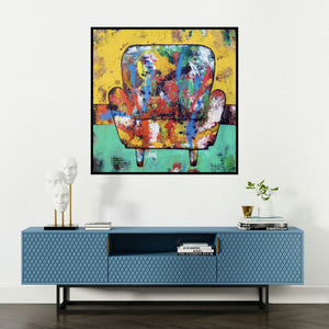 'The Mighty Chair 3 (The Vibrant Armchair)' painting by Prashalee Gaikwad shown on a wall in a furnished room.