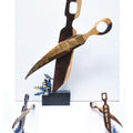 Still-life sculpture titled 'Transformation 2', 27x14x7 inches, by artist Renu Bala on Wood, Metal