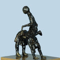 Figurative sculpture titled 'Village Play', 11x9x7 inches, by artist Kishor Sharma on Bronze